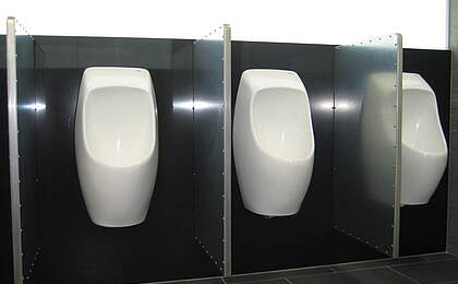 Railway station with waterless urinals